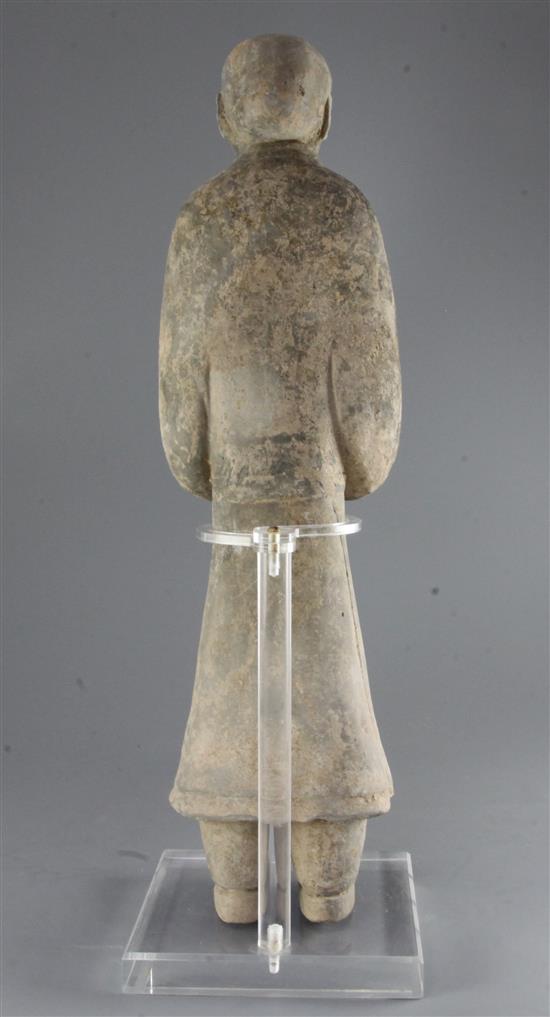 A large Chinese grey pottery standing figure of a civil official, Western Han dynasty (206BC-9AD), height 58cm, modern stand